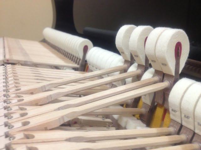 A new set of hammers replaced on a yamaha grand piano