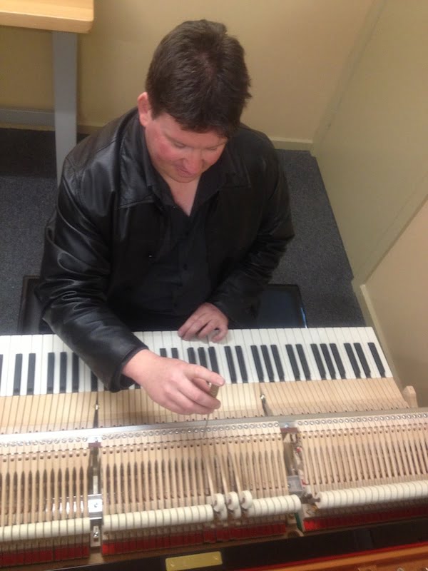 completing regulation service on a yamaha grand piano in Melbourne